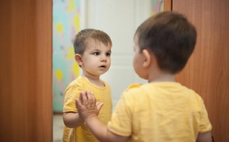 How does a child perceive himself looking in the mirror?